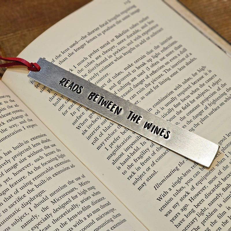 READS BETWEEN THE WINES Hand Stamped Aluminum Book Mark with Leather Bookmark