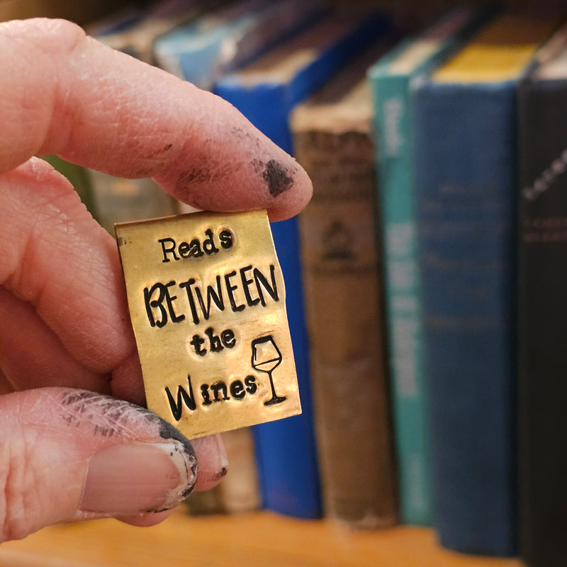 Reads Between the Wines - Hand Stamped Brass Bookmark