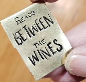Reads Between the Wines - Hand Stamped Brass Bookmark